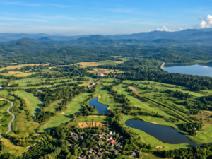 Aerial view of Chiang Mai Highlands Golf course surrounded by mountains