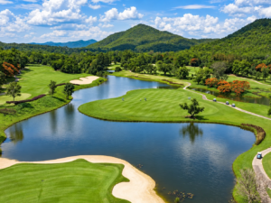 Alpine Chiang Mai Golf course with lake, greens and mountain views